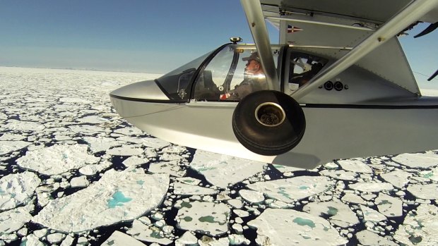 Michael Smith flies over ice floes between Iceland and Greenland.