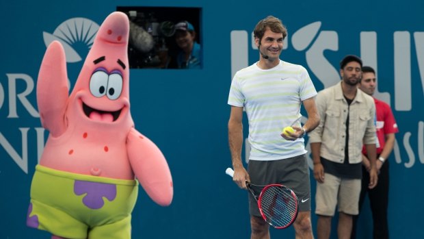 Roger Federer took to the court at the Brisbane International kids tennis day under the watchful gaze of Nickelodeon's Patrick Star.