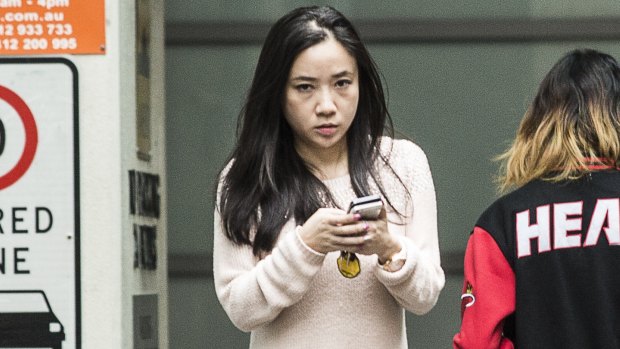 Yingying Dou leaves the Sydney premises where she works.