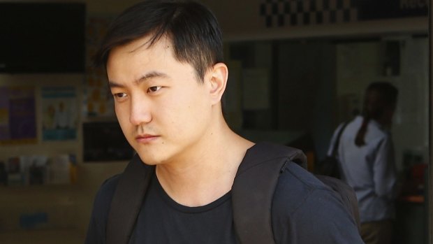 Sicen Sun, who allegedly made replica guns with a 3D printer, leaves court after being released on bail. 