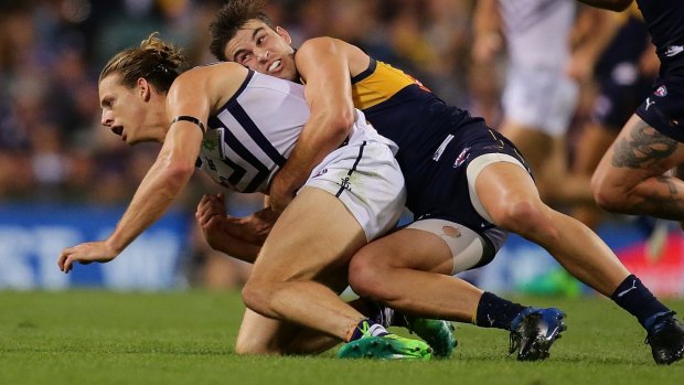Dockers captain Nat Fyfe is tackled by Elliot Yeo, of the Eagles, during the round six derby. 