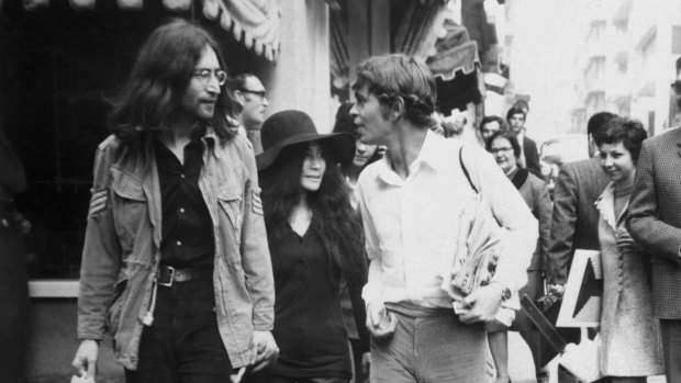 John Lennon  with wife Yoko Ono and Greek host, Alexis Mardas,  during a tour of Athens' shops. 