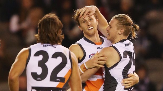 Former Magpie Craig Stewart said the manner in which the Magpies rejected his son James (centre) was a cautionary tale for the competition.