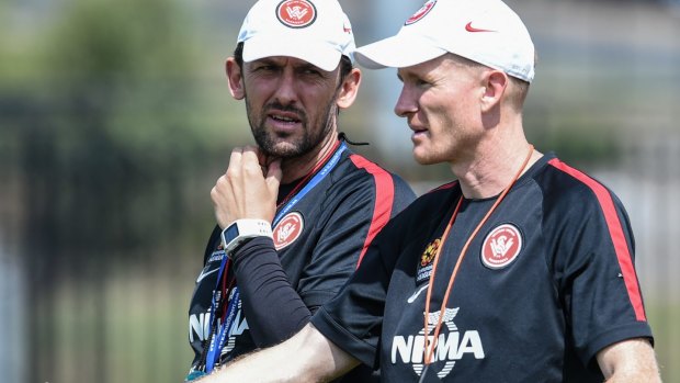 Hayden Foxe (right) with his predecessor Tony Popovic.