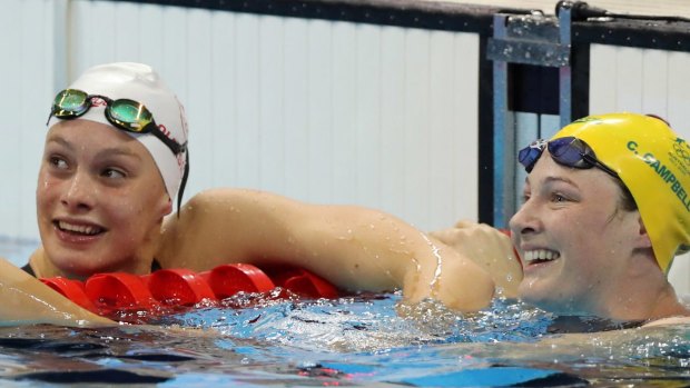 Cate Campbell, right, celebrates with Penny Oleksiak.