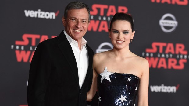 Bob Iger and Daisy Ridley arrive at the LA premiere of Star Wars: The Last Jedi.