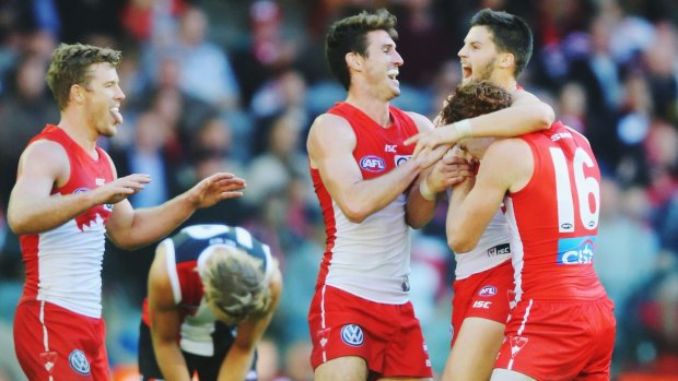 Swans on song: Sydney's Nic Newman celebrates a goal with teammates.