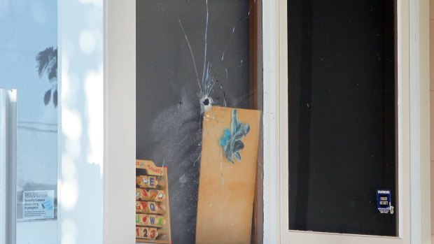 A boy was sleeping when someone fired a bullet through the window of his room. 