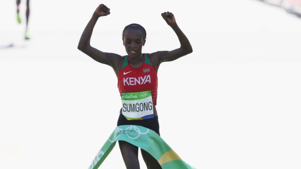 Making history: Jemima Jelagat Sumgong of Kenya crosses the finish line at the Rio 2016 women's marathon.
