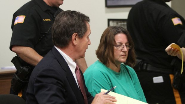 Michelle Lodzinski, centre, sits beside her attorney Gerald Krovatin in the New Jersey Superior Court in 2014.