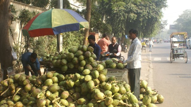 Coconut water seller Mohan Kishore says the cash crisis has made it hard for him to pay his suppliers but he feels the hardship is worth it for the "punishment" of the rich.
