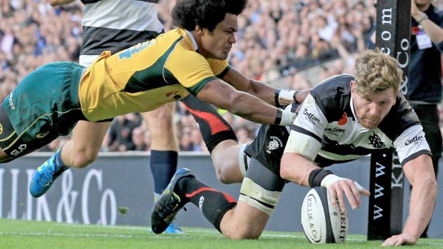 Reds recruit Adam Thomson scores a try for the Barbarians against the Wallabies in November.