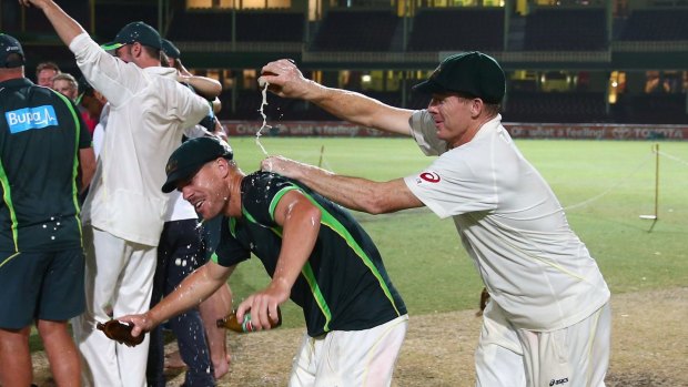 More beer ... Chris Rogers pours a VB on David Warner at the SCG in 2014.