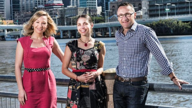 Queensland Greens leader Senator Richard di Natale with deputy leader Senator Larissa Waters and candidate Kirsten Lovejoy. They will call for an inner-city school to built within the new Queens Wharf resort behind them near George Street.