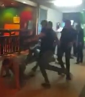 A screen shot from the video posted on Facebook that appears to show Thai guards at a nightclub beating up tourists. 
