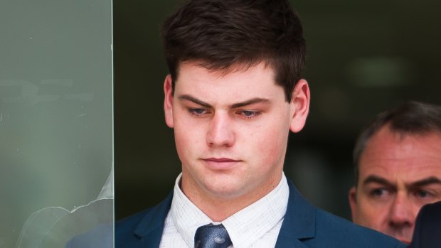 ADFA cadet Jack Toby Mitchell leaves the ACT Magistrates Court after pleading not guilty to raping a fellow cadet while she was sleeping.
