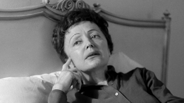 French songstress Edith Piaf props up in bed in 1959 after an undisclosed illness. Piaf died in 1963 from exhaustion and liver disease, aged of 47. 