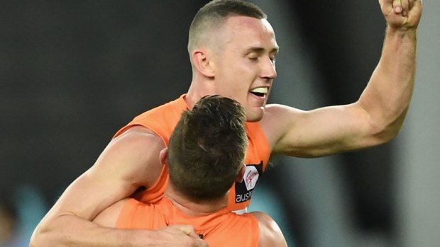 Tom Scully celebrates a goal against the Swans.