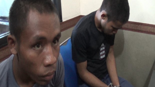 Two men in police custody, Urbanus and Yohanes, allegedly involved in the murder of Australian expat Robert Ellis in Bali.
