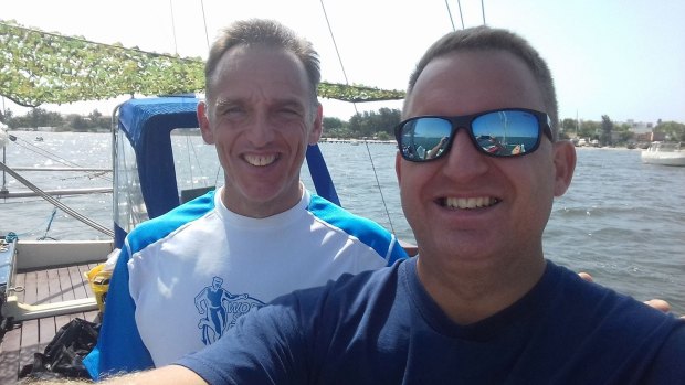 Last selfies: Hooper poses with one of his team members before the swim.