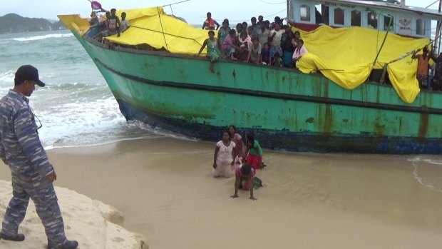 The Sri Lankan women disembark the boat against the orders of the Indonesian authorities.