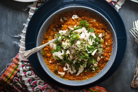 This butter chicken-inspired dhal can be made vegetarian - just swap the stock and hold the shredded chook (pictured as a topping).