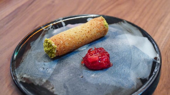 Duck liver parfait cannoli with pistachio and spritz relish.