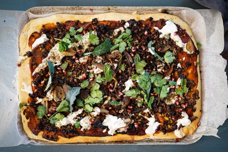 Lamb, maple, sumac and pistachio 'pizza' with tahini yoghurt and charred onions. 