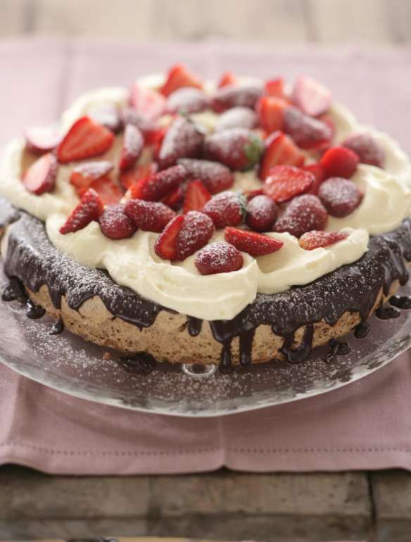 Hazelnut gateaux with chocolate ganache, whipped cream and strawberries.