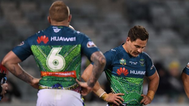 Dejected Raiders halves Blake Austin and Aidan Sezer after Canberra's loss to the Cowboys.