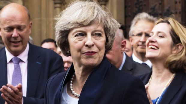 Theresa May is applauded by Conservative Party members after being elected party leader "with immediate effect".
