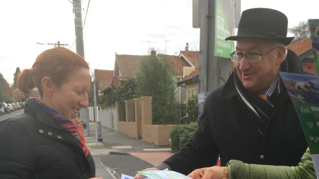 Michael Danby hands out his how to vote cards on election day.