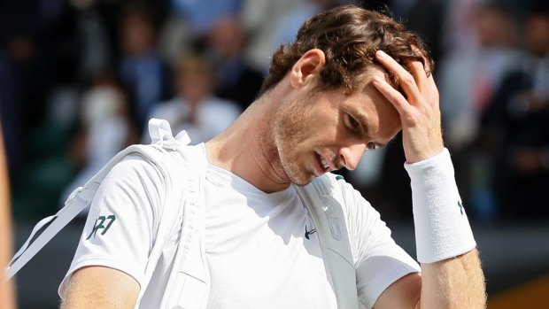 Defending champion Andy Murray leaves the court after a shock loss to Sam Querrey.