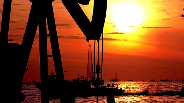 A Venezuelan oil well is seen during sunset on Maracaibo Lake, Zulia State, about 700 kilometers west of Caracas.