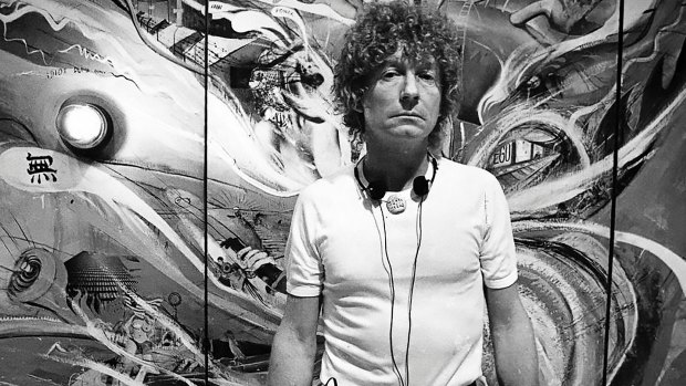 Brett Whiteley in front of his monumental multi-panel piece The American Dream in 1983. 