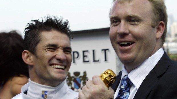 All smiles: Jockey Corey Brown and trainer Tim Martin celebrate after Exceed And Excel won the Newmarket Handicap in 2004. 