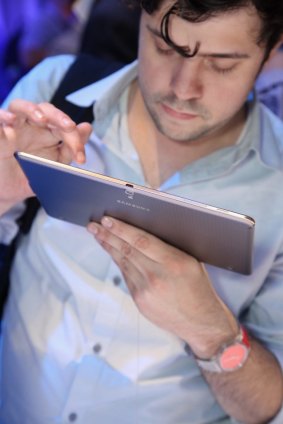 A guest uses the Galaxy Tab S at Samsung's launch event.