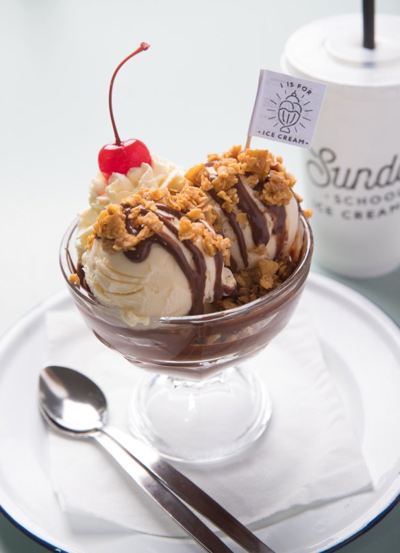 Ice-cream sundae with brown butter peanuts and salted chocolate fudge.