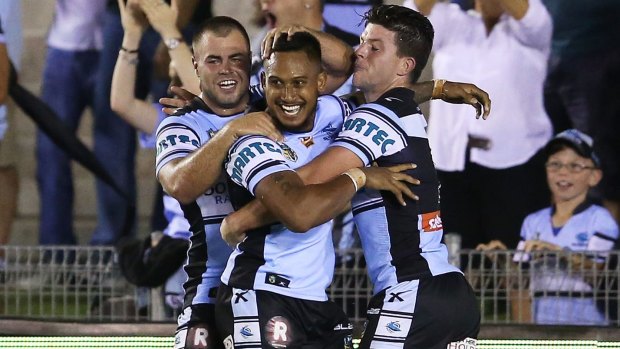 No.1 with a bullet: Sharks fullback Ben Barba celebrates with teammates after scoring.