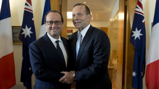 French connection: Tony Abbott (pictured with French President Francois Hollande) says it is essential that countries set a strong binding emissions reductions target at the 2015 climate conference in Paris.