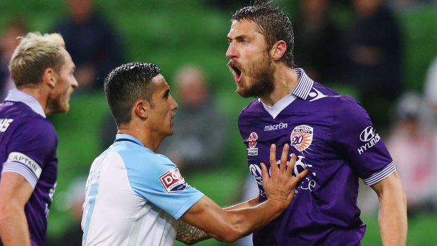 City's Tim Cahill holds back Dino Dulbic who reacts after giving away a penalty at AAMI Park.