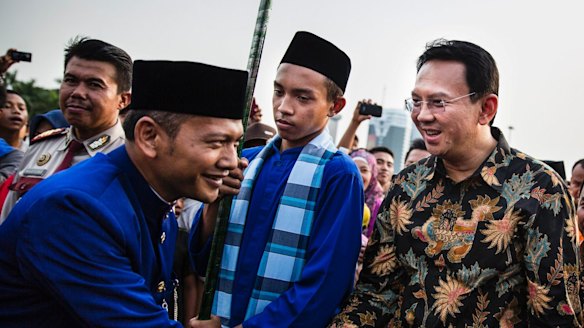 Ahok, right, in 2014. A Christian and ethnic Chinese, he became governor after his predecessor and political ally Joko Widodo was elected President of Indonesia.