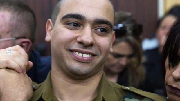 Sergeant Elor Azaria waits with his parents for the verdict inside the military court in Tel Aviv.