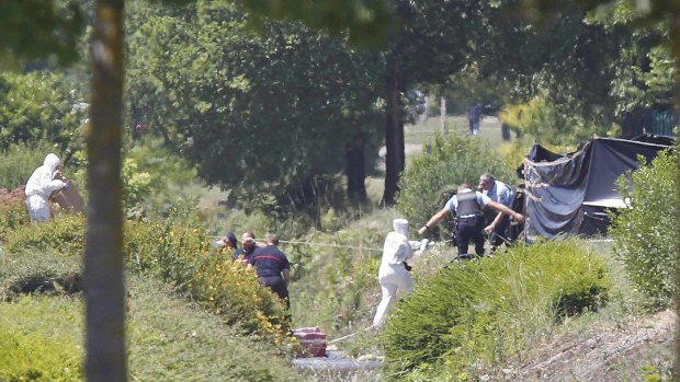 French crime scene investigators examine the site where the remains were located.