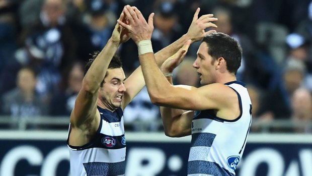 Harry Taylor (right) is congratulated by teammate Daniel Menzel.