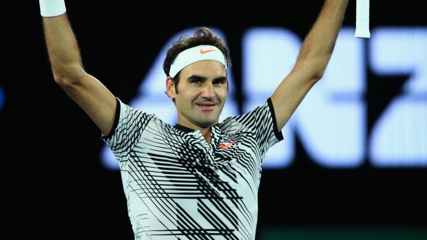 Roger Federer celebrates with the crowd  after his victory.