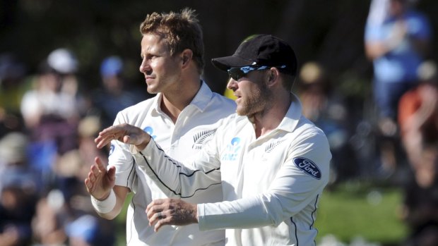 New Zealand's Neil Wagner, left, celebrates with his captain Brendon McCullum after dismissing Joe Burns.