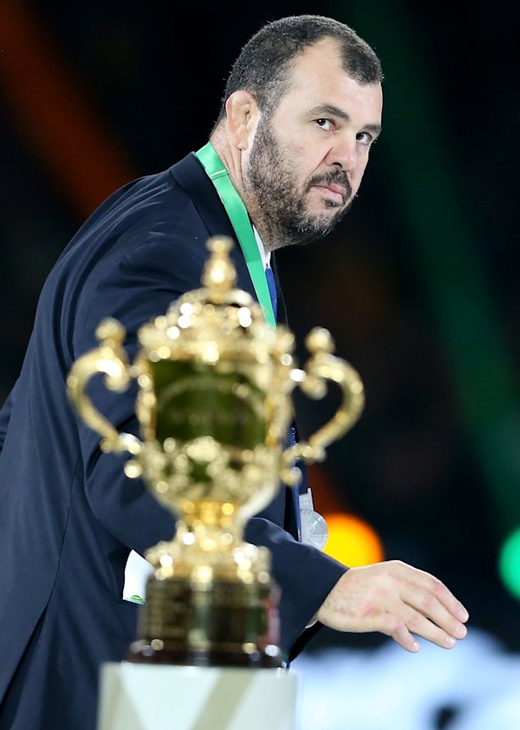 So close, so far: Michael Cheika passes by the Webb Ellis Cup following defeat in the 2015 Rugby World Cup final.