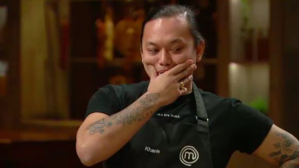 Khanh wonders if he should wear the black logo t-shirt or the white logo t-shirt if he gets through this elimination.