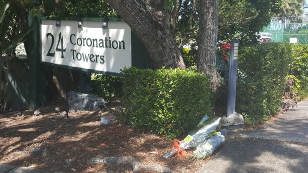 Floral tributes left at the apartment complex in Auchenflower.